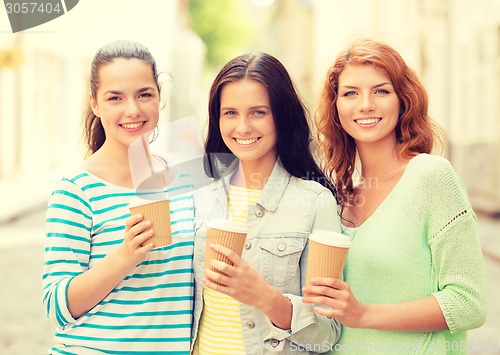 Image of smiling teenage girls with on street