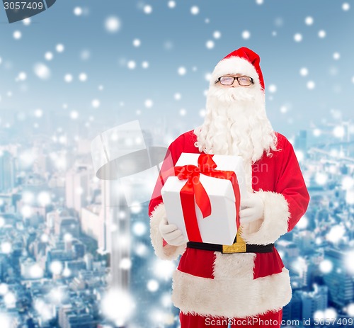 Image of man in costume of santa claus with gift box