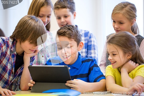 Image of group of school kids with tablet pc in classroom