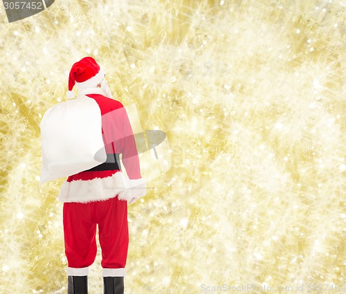 Image of man in costume of santa claus with bag