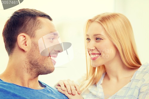Image of smiling happy couple at home