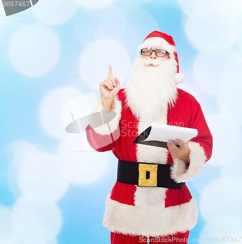 Image of man in costume of santa claus with notepad