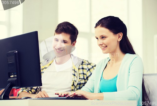 Image of two smiling students having discussion