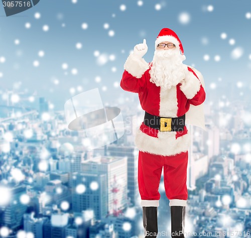 Image of man in costume of santa claus with bag