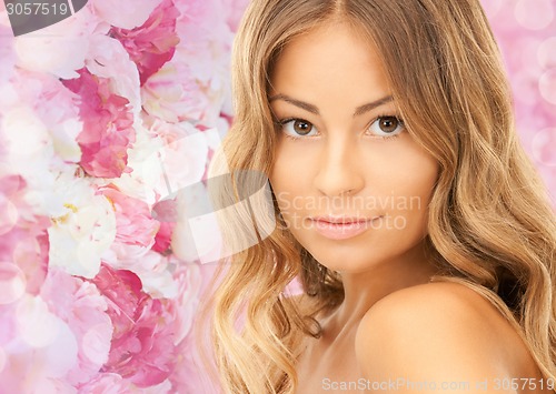 Image of beautiful young woman with bare shoulders