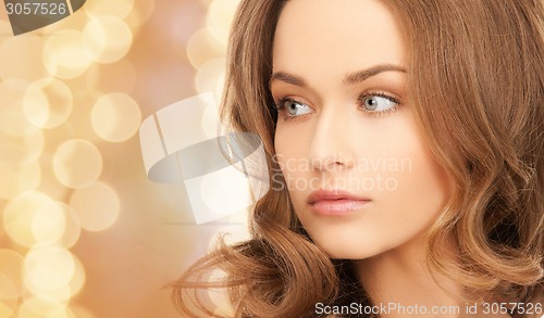 Image of beautiful young woman with bare shoulders