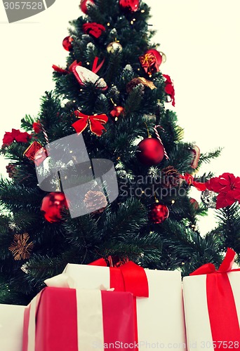 Image of close up of christmas tree and presents