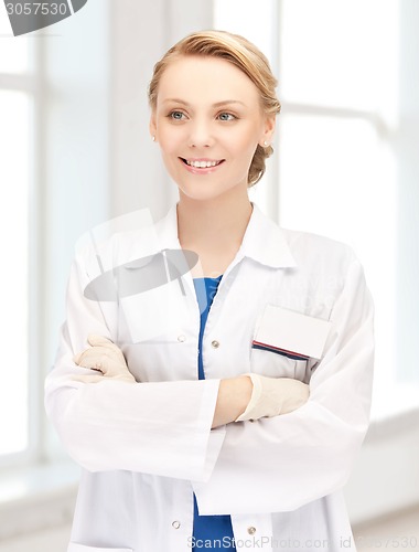 Image of smiling young female doctor in hospital
