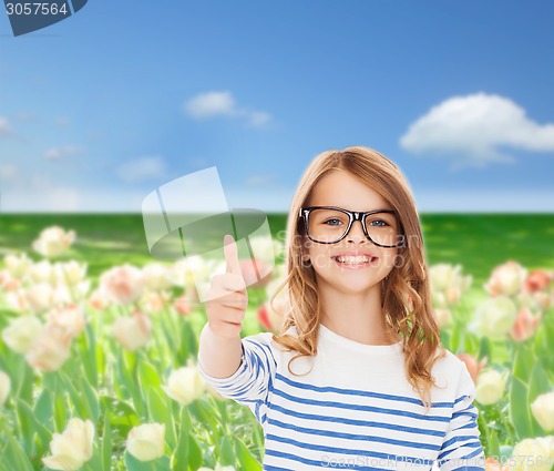 Image of little girl with black eyeglasses