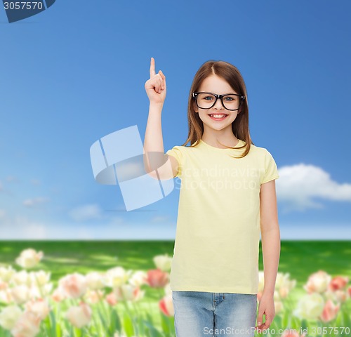 Image of smiling cute little girl in black eyeglasses