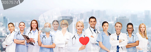 Image of smiling doctors and nurses with red heart