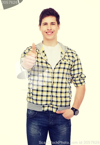 Image of smiling student boy showing thumbs up