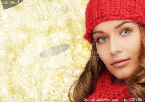 Image of close up of smiling young woman in winter clothes