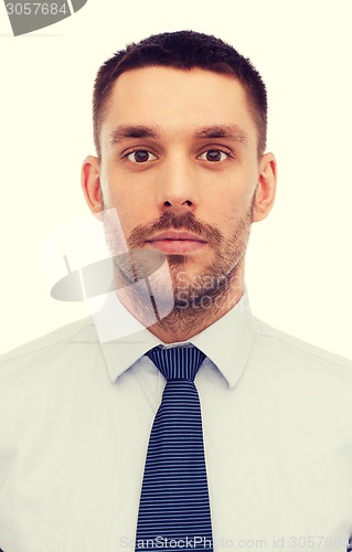 Image of portrait of serious businessman