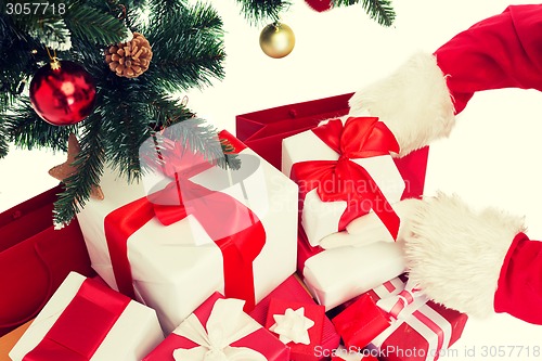 Image of close up of santa claus with presents