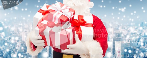 Image of close up of santa claus with gift box