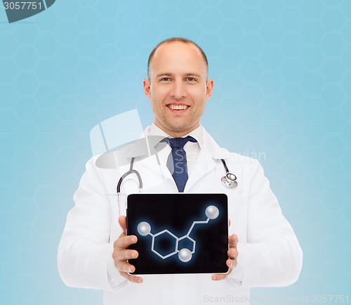 Image of smiling male doctor showing tablet pc screen