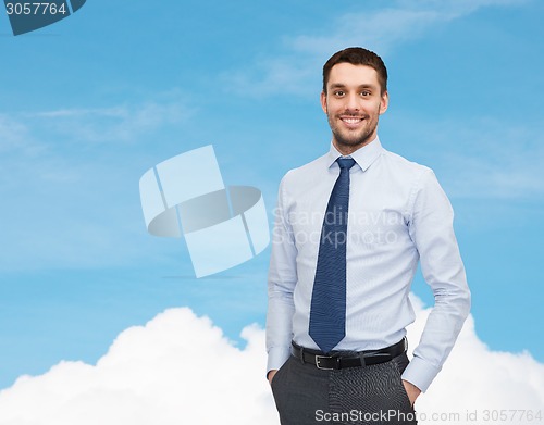 Image of smiling young and handsome businessman