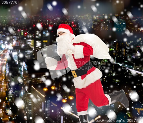 Image of man in costume of santa claus with bag