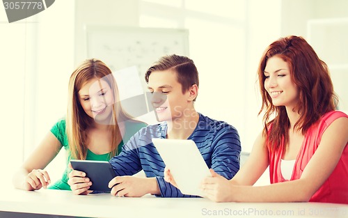 Image of smiling students with tablet pc at school