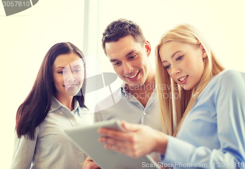 Image of business team working with tablet pc in office