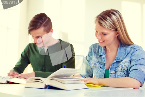 Image of students with textbooks and books at school