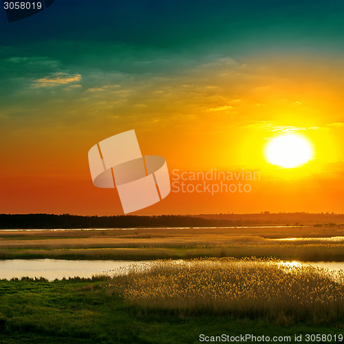 Image of dramatic sunset over river