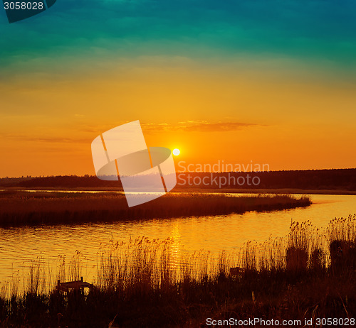 Image of orange sunset over river