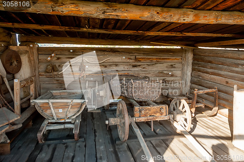 Image of Wooden cart and other stock in museum