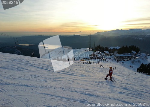 Image of Young Skier going down the slope at Monterone Alps Italy