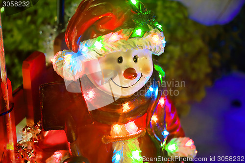 Image of Christmas figurine toy dressed in santa costume with led lights