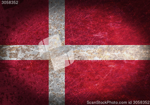 Image of Old rusty metal sign with a flag