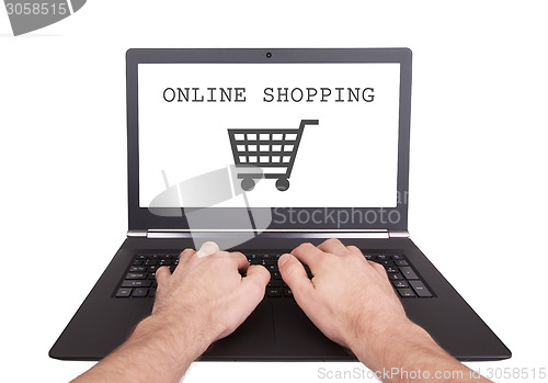 Image of Man working on laptop, online shopping