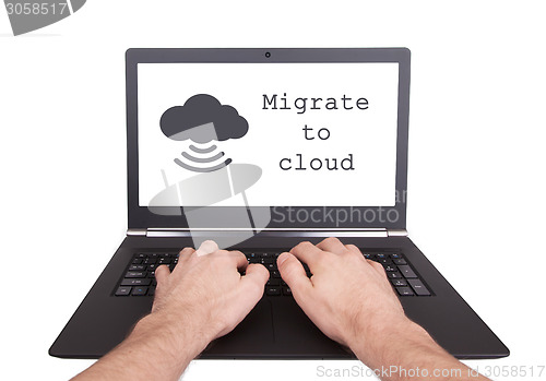 Image of Man working on laptop, migrate to cloud