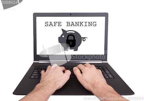 Image of Man working on laptop, safe banking