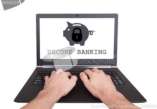 Image of Man working on laptop, secure banking