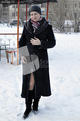 Image of Portrait of the young beautiful woman in the winter on the stree