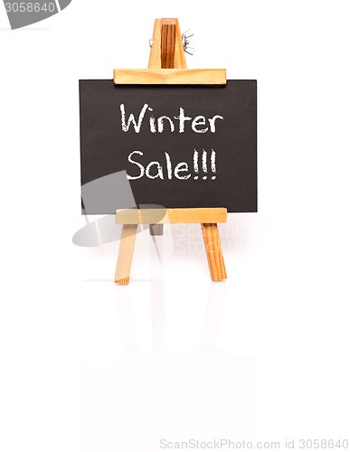 Image of Winter Sale. Blackboard with text and easel.
