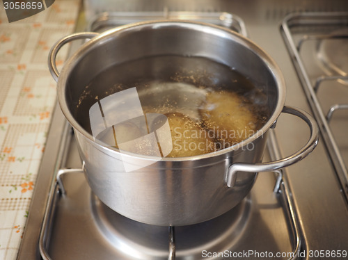 Image of Saucepot with potatoes on cooker