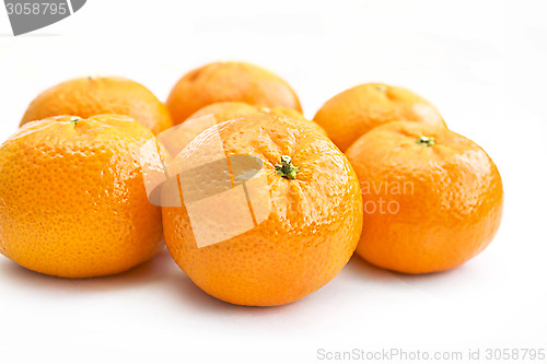 Image of Ripe tangerines on white background