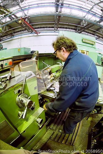 Image of Milling-machine operator works at  machine