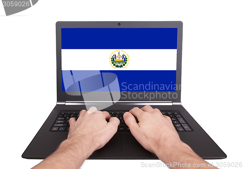 Image of Hands working on laptop, El Salvador
