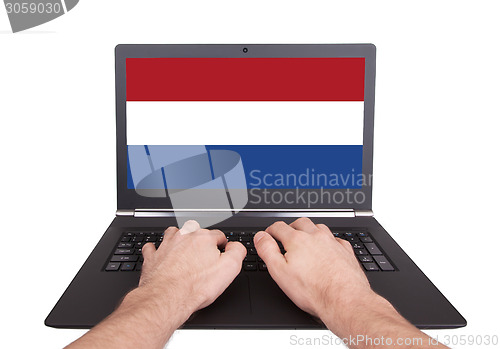 Image of Hands working on laptop, the Netherlands