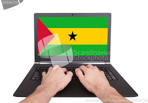 Image of Hands working on laptop, Sao Tome and Principe