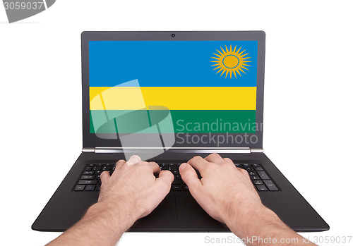 Image of Hands working on laptop, Rwanda