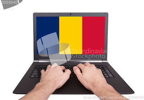 Image of Hands working on laptop, Romania