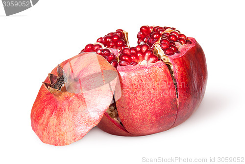Image of Broken Bright Ripe Juicy Pomegranate With Lid Near
