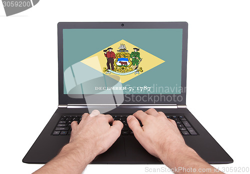 Image of Hands working on laptop, Delaware
