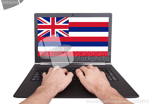 Image of Hands working on laptop, Hawaii