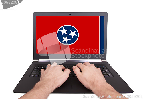 Image of Hands working on laptop, Tennessee